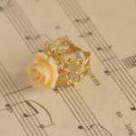 Cream orange resin rose flo..