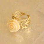 Cream orange resin rose flo..